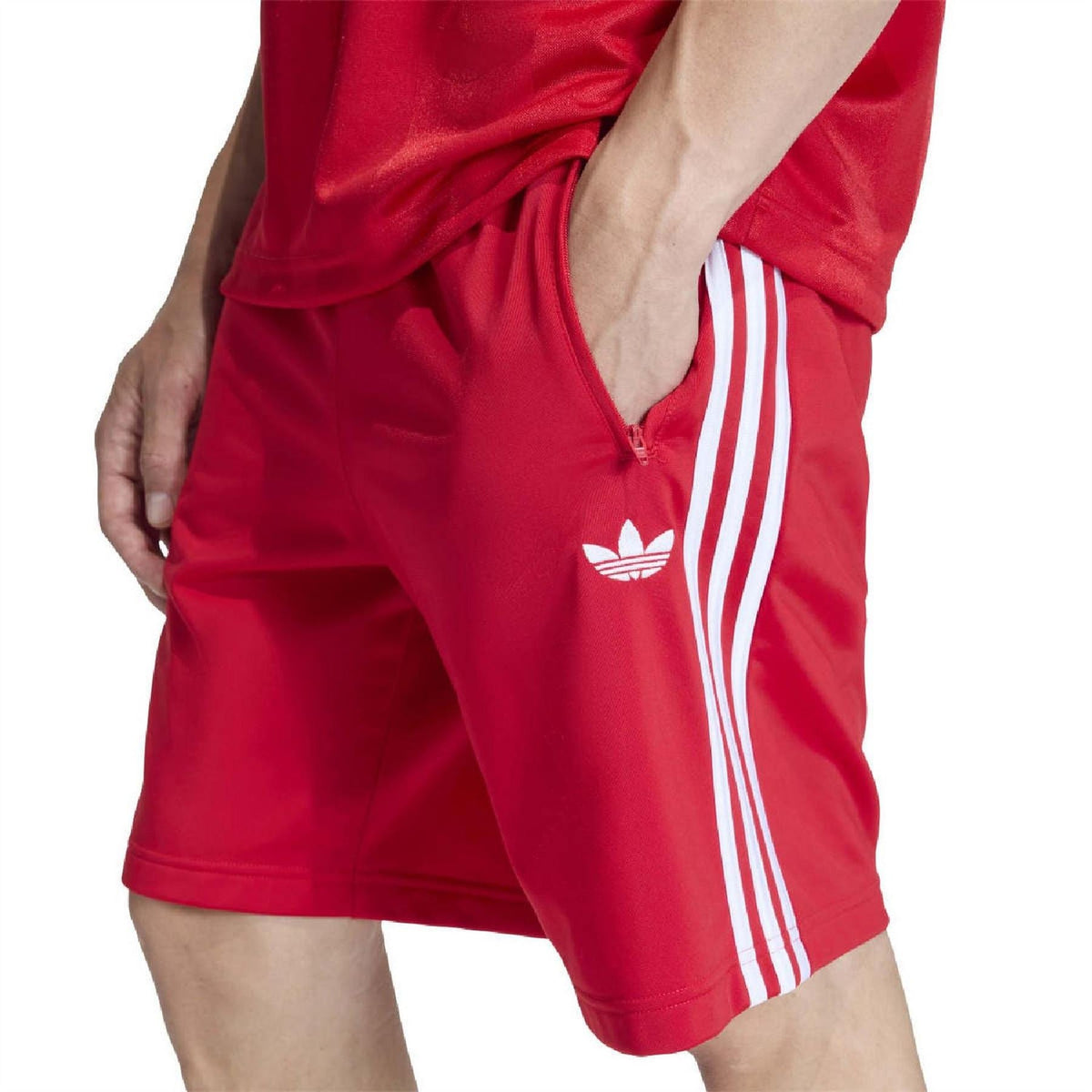 Scarlet red bermuda shorts with zip side pocket, adidas trefoil on thigh, white stripes