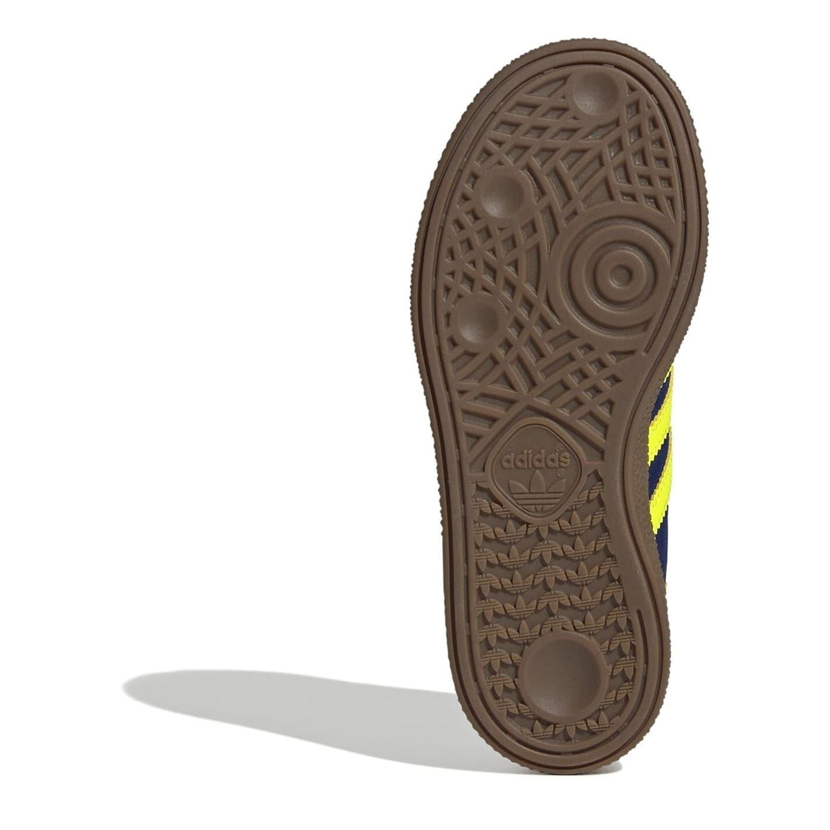 Kids' adidas Spezial sneaker outsole in brown with molded tread and neon yellow side stripe