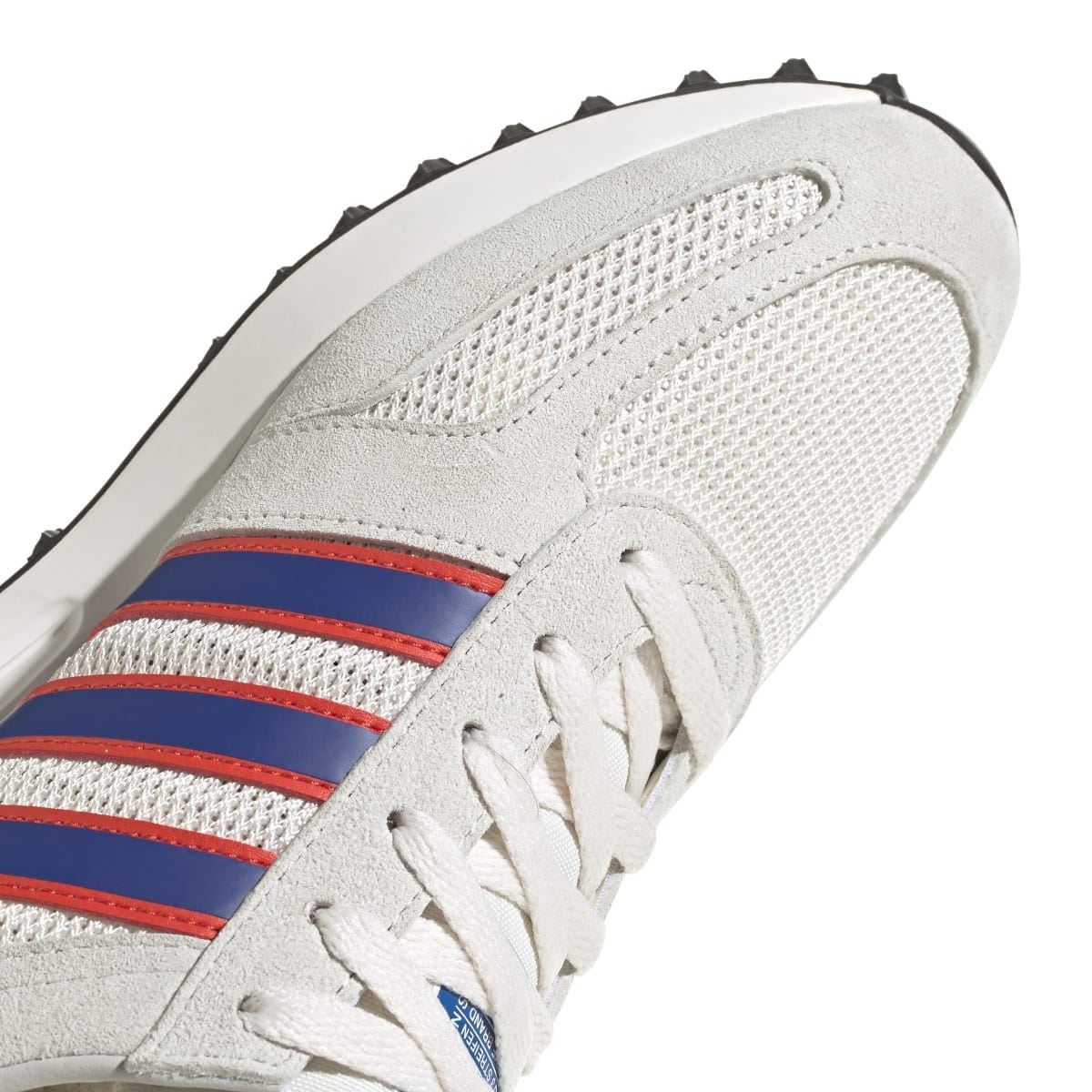 Men's adidas Originals LA trainer toe and lace area with blue-red stripes