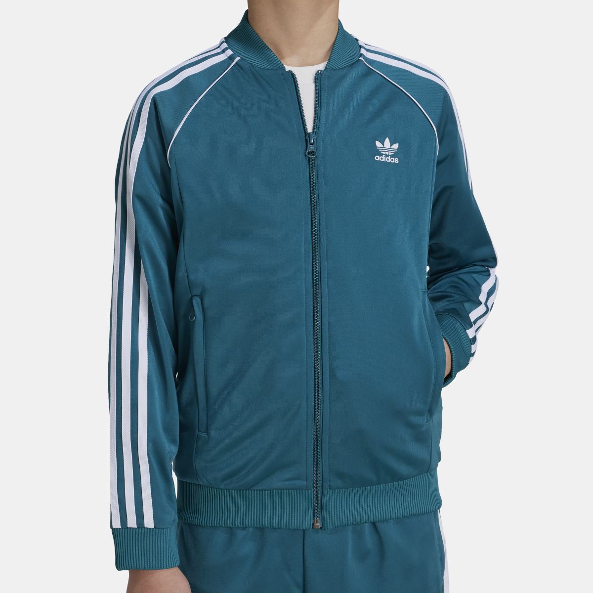 Teal track jacket with stand collar, center zip, and white side stripe detailing.