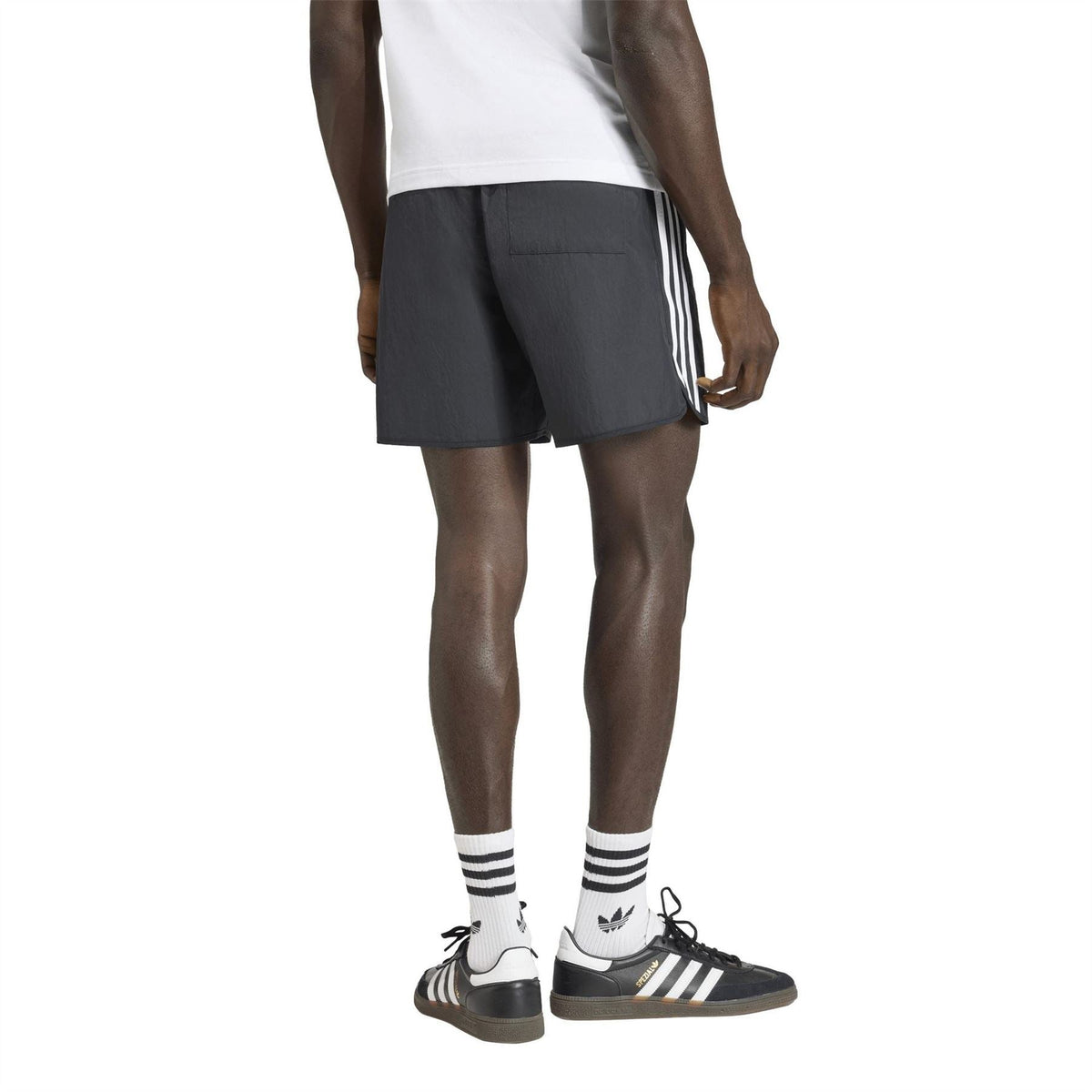 adidas Originals black shorts with white side stripes, straight hem and mid-thigh length