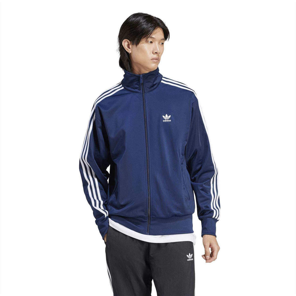 Men's indigo adidas track jacket with full zip, stand collar, and white triple stripes