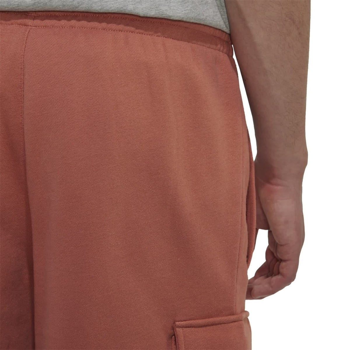 Brown shorts close-up: elastic waist and front seam