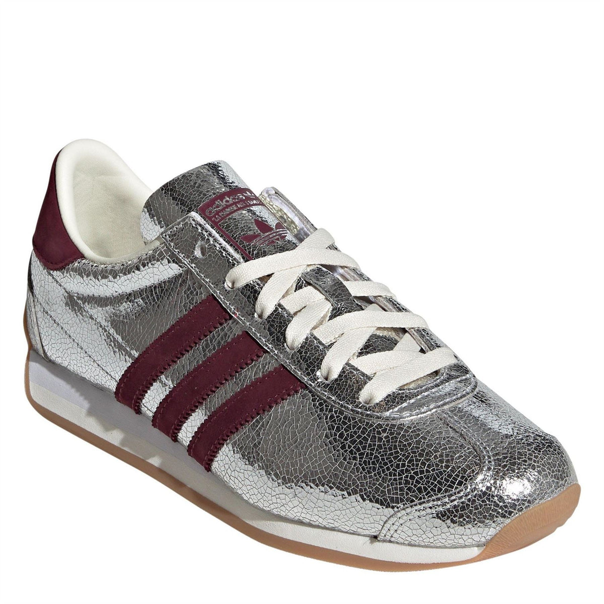 Adidas Originals Country OG TR footwear in beige with white accents, featuring classic sneaker design and textured sole.
