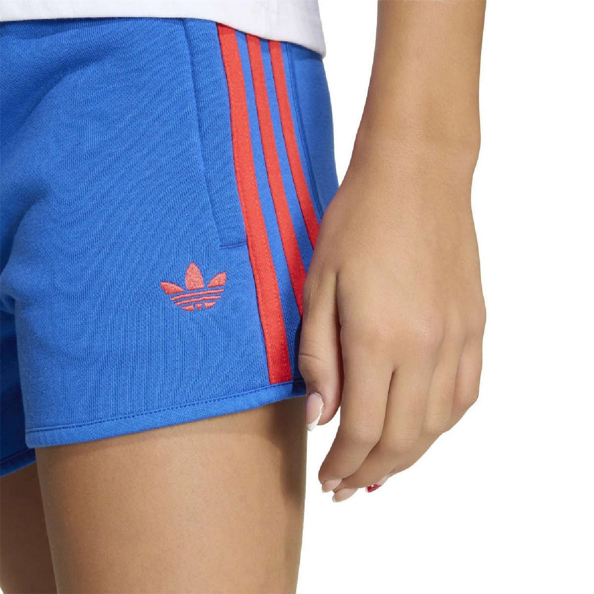 Close-up of blue waistband and drawstring with red side stripes on juniors shorts
