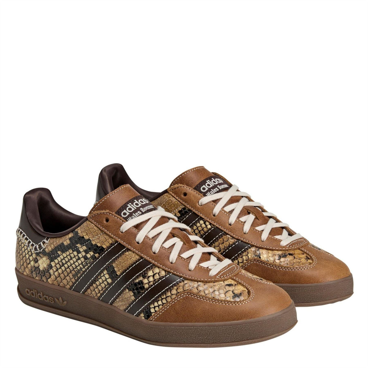 Pair of adidas Originals low-top trainers with brown uppers, snake-print stripes, white laces