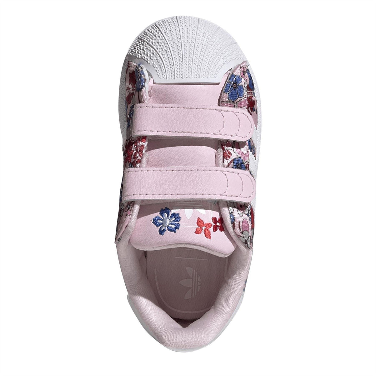 Kids sneaker toe with hook-and-loop strap, floral print upper, and cushioned lining