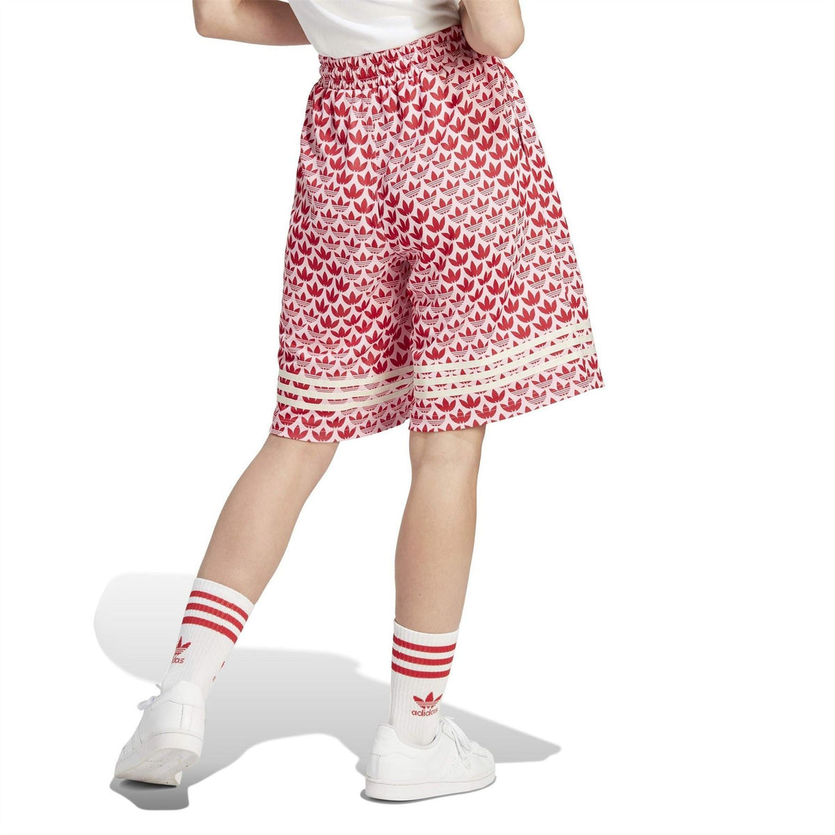 Red and white leaf-print knee-length shorts with elastic waist and striped hem