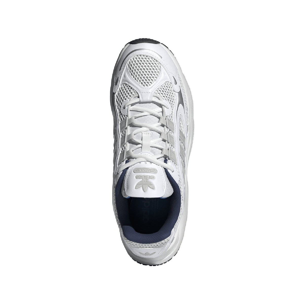 White lace-up trainer with navy interior lining and textured mesh upper