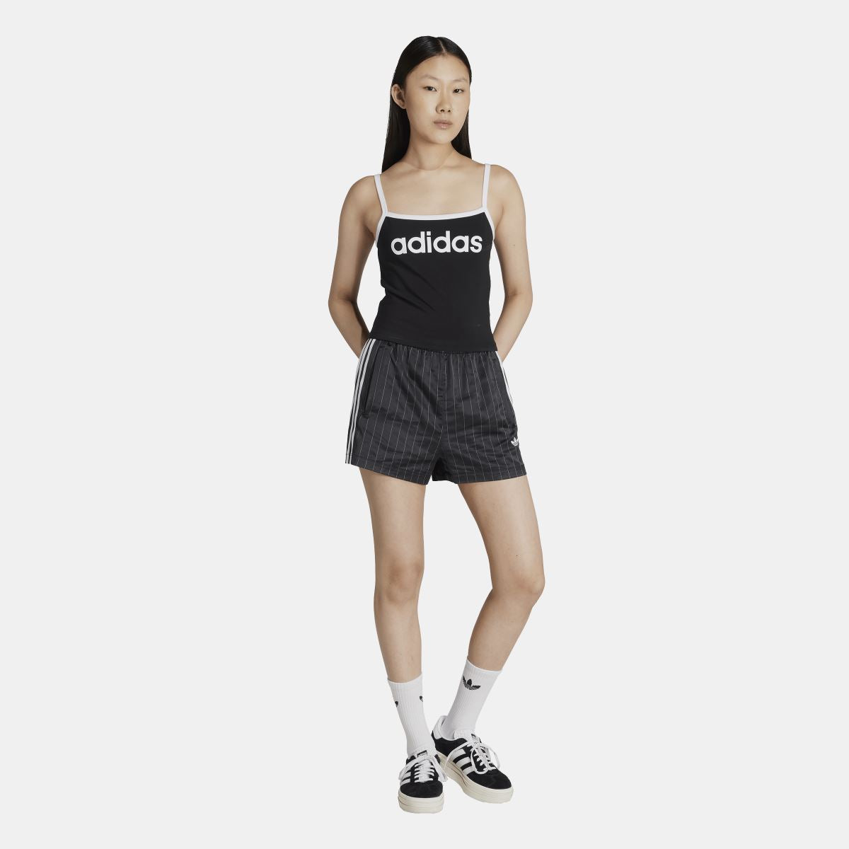 Black adidas tank top with logo band, thin straps and fitted silhouette