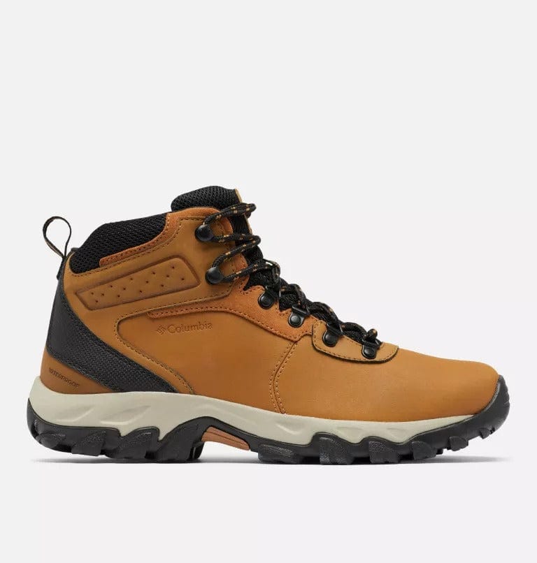 Hiking boots side view in tan with black upper, brown lace-up, and thick tread