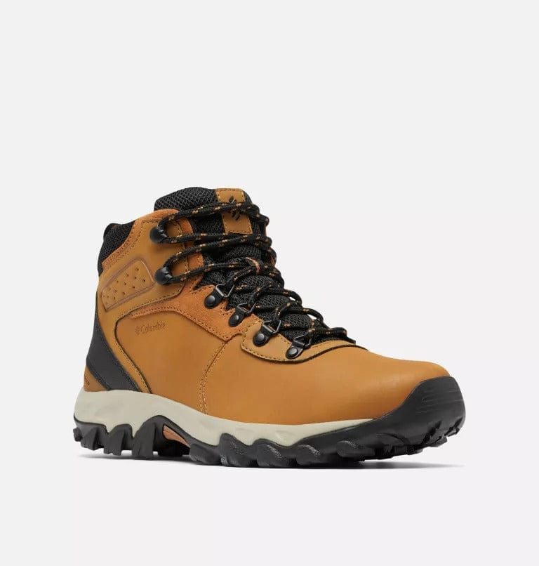 Hiking boots angled view in tan with black laces and black lug outsole