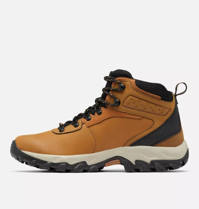Hiking boots side view in tan with black collar, lace-up, and black tread
