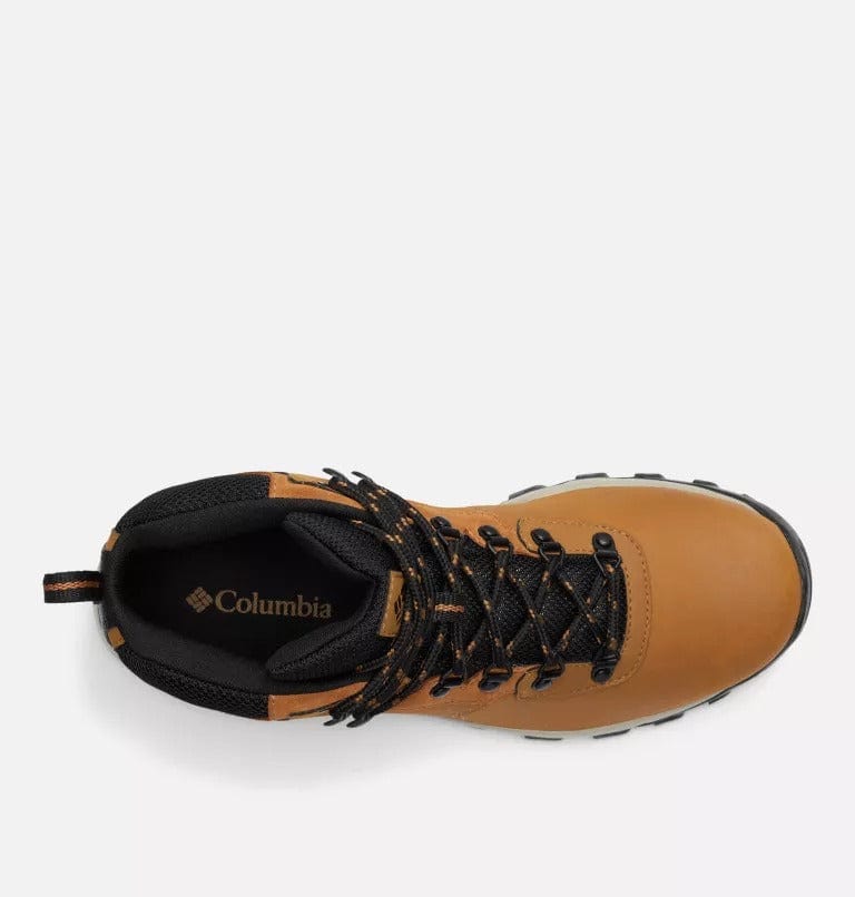 Hiking boots close-up of tongue and collar with Columbia logo in tan and black