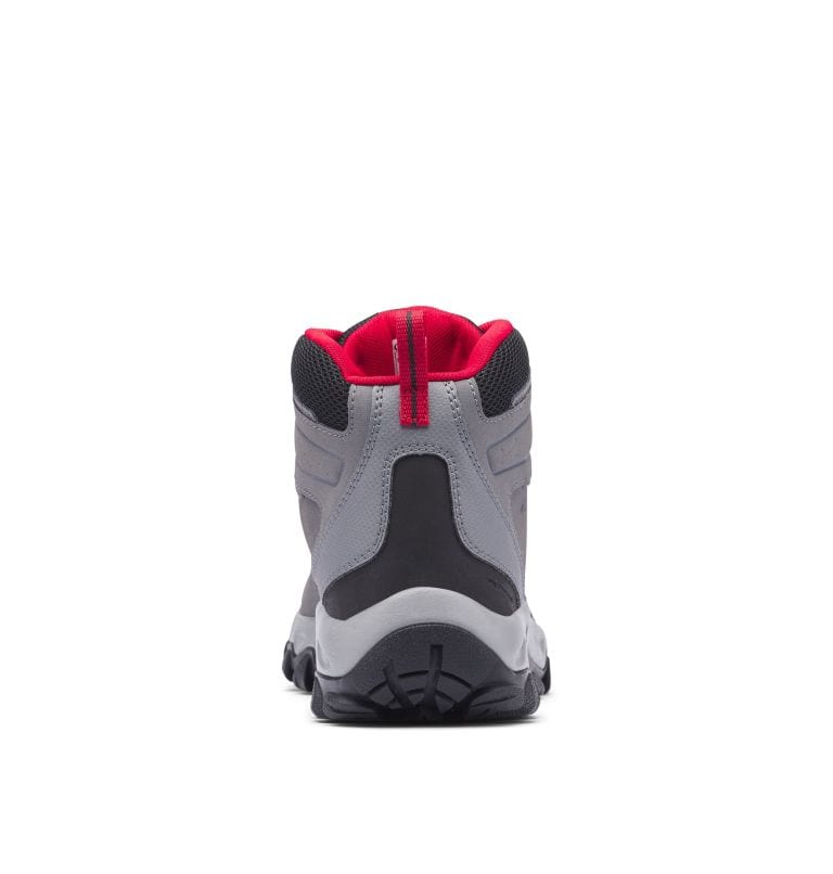 Back view of gray waterproof hiking boot with black heel panel and red lining.