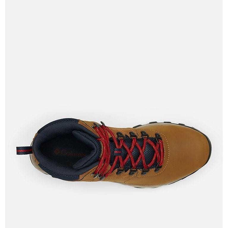 Tan waterproof hiking boot with red lace-up, navy collar lining, and tread sole