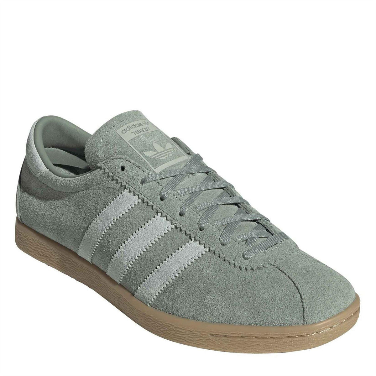 adidas Originals low-top sneakers, light green suede upper with lace-up eyelets and gum sole