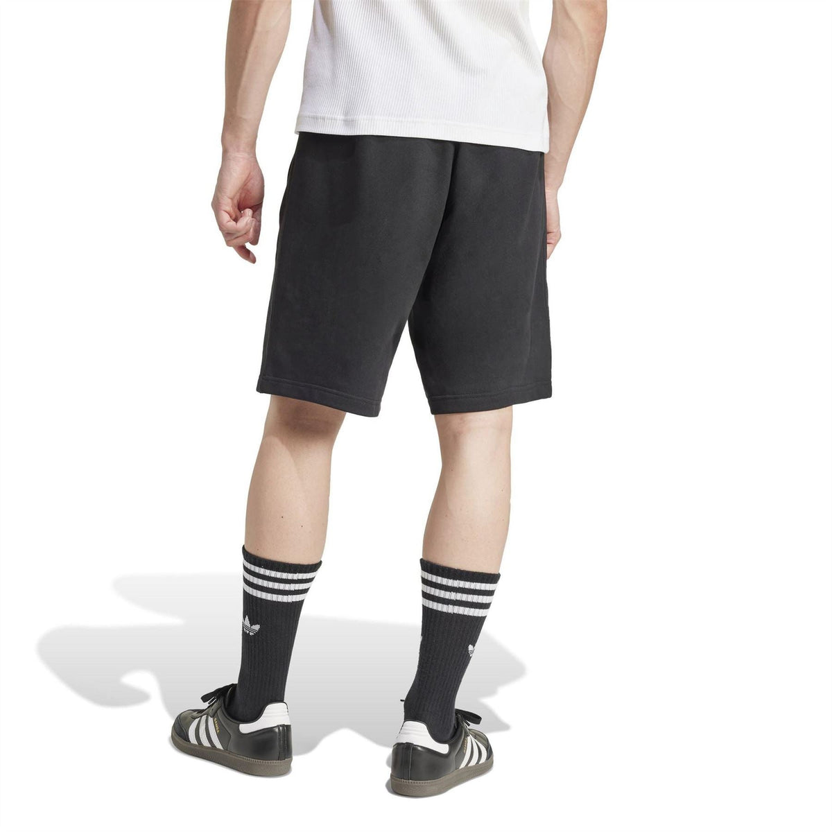 Black sweat shorts with elastic waistband and straight knee-length hem