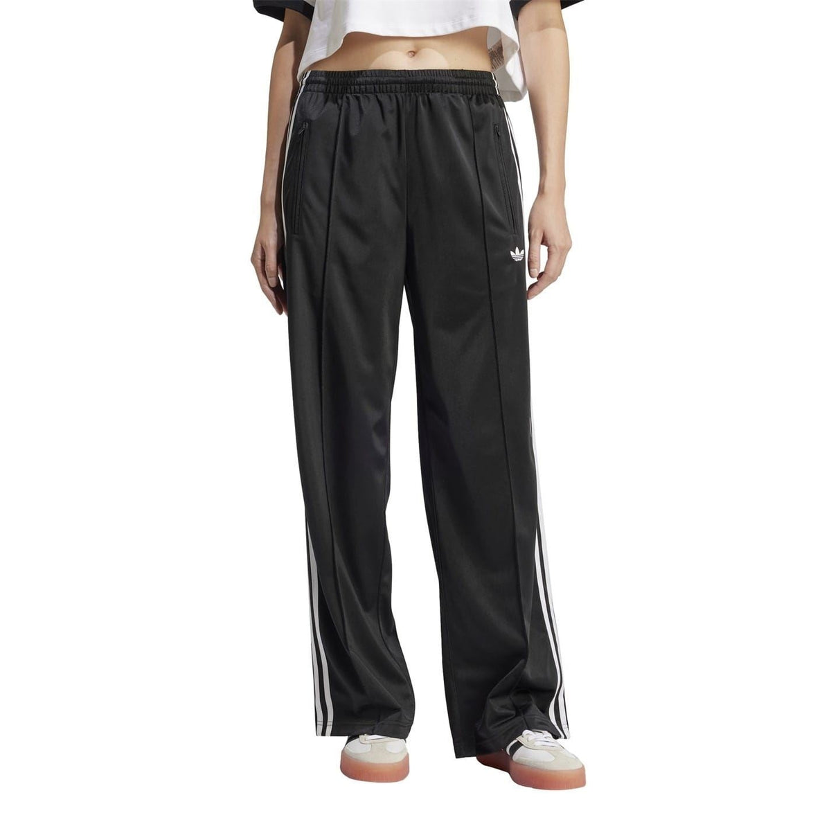 adidas Originals loose black track pants with white side stripes and elastic waistband