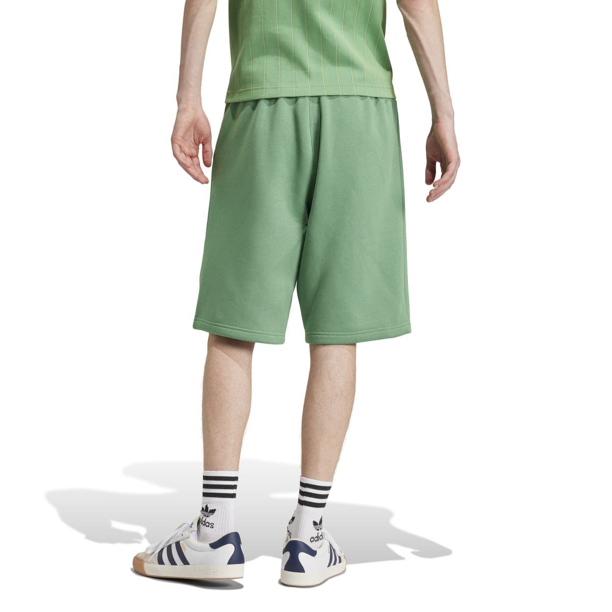 Green adidas trefoil shorts with relaxed legs and elastic waistband