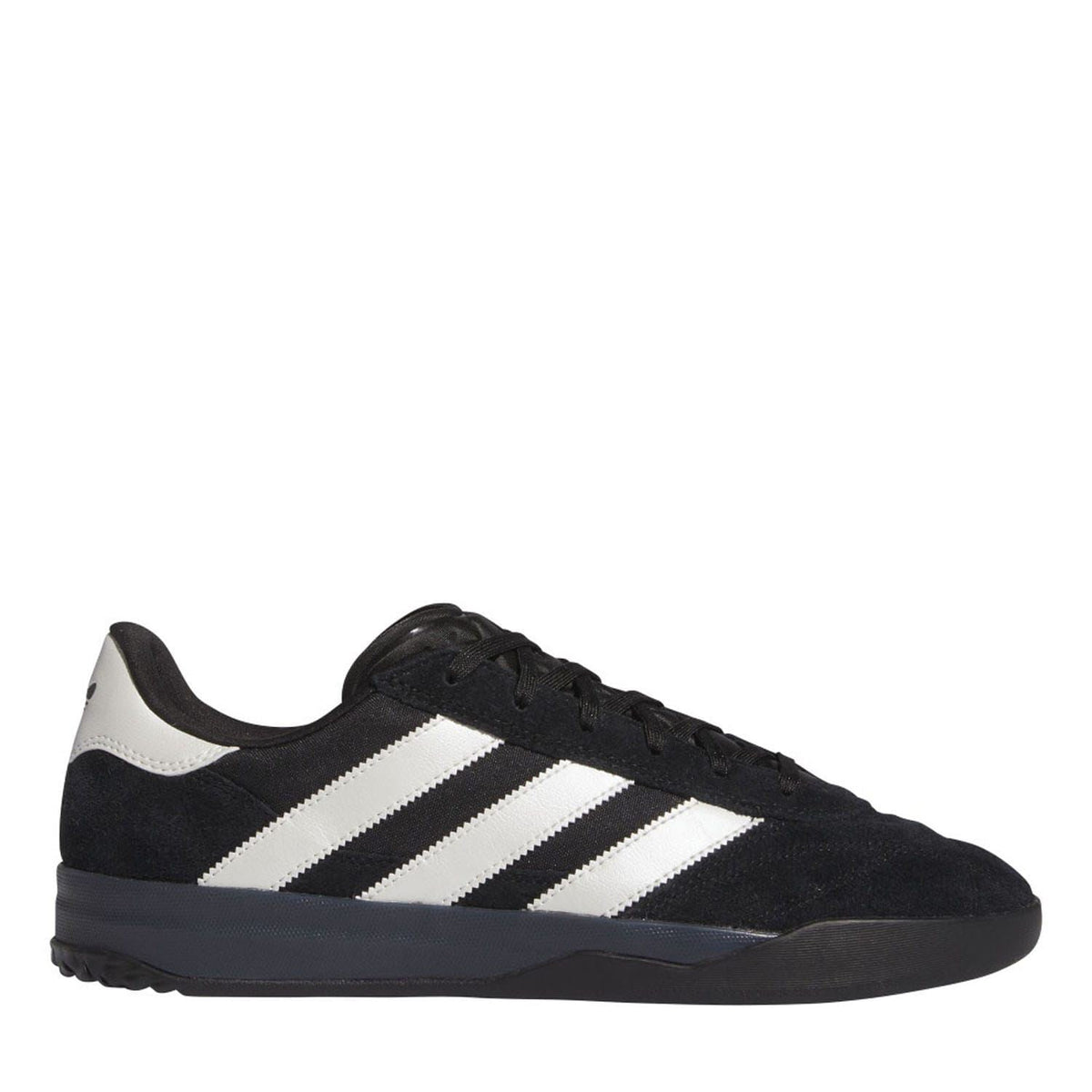 Black adidas trainers with white three stripes, black laces, and low-profile sole