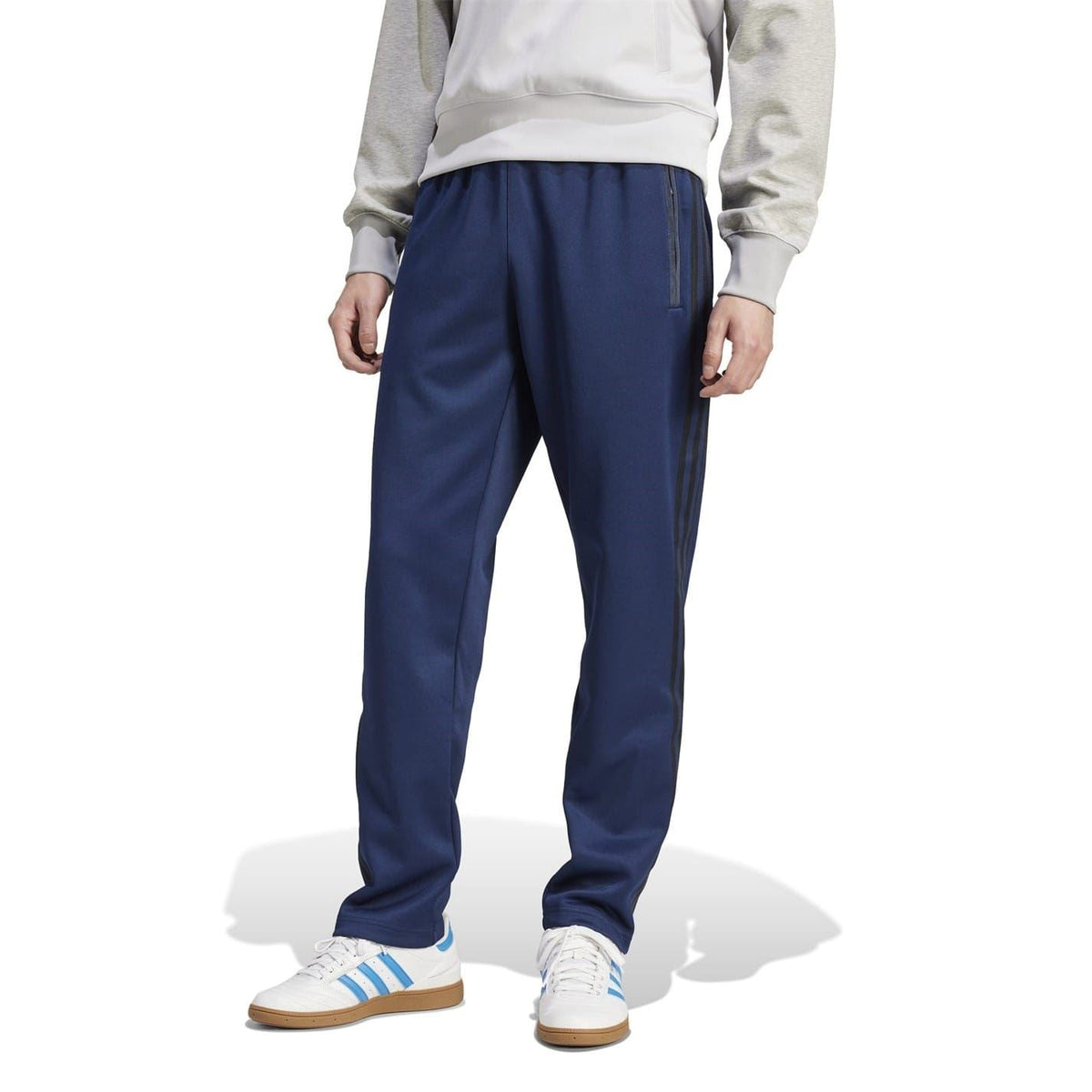 Navy blue straight joggers with side stripes, relaxed fit, and elastic cuffs