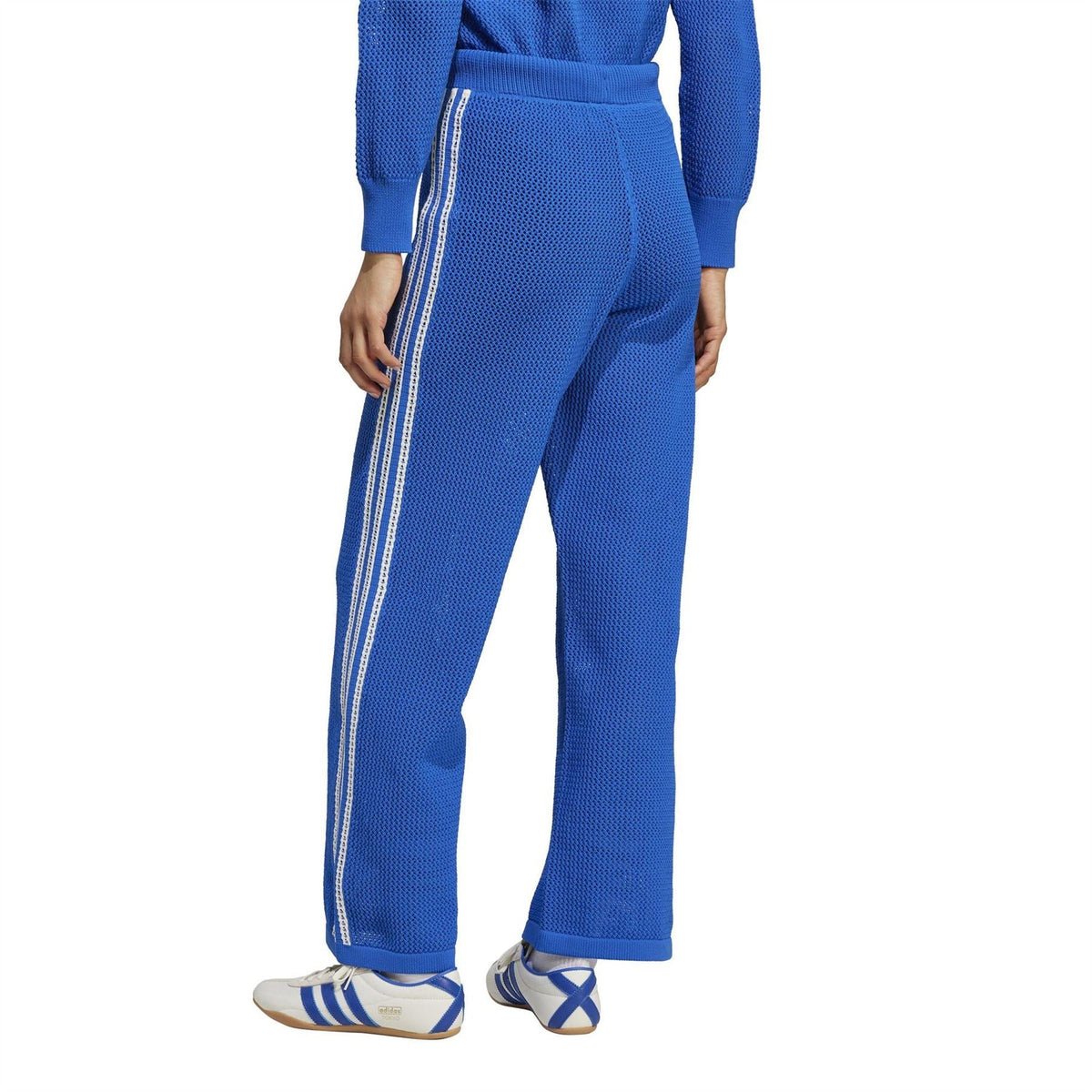 adidas Originals crochet track pants with vertical side stripes and ribbed cuffs