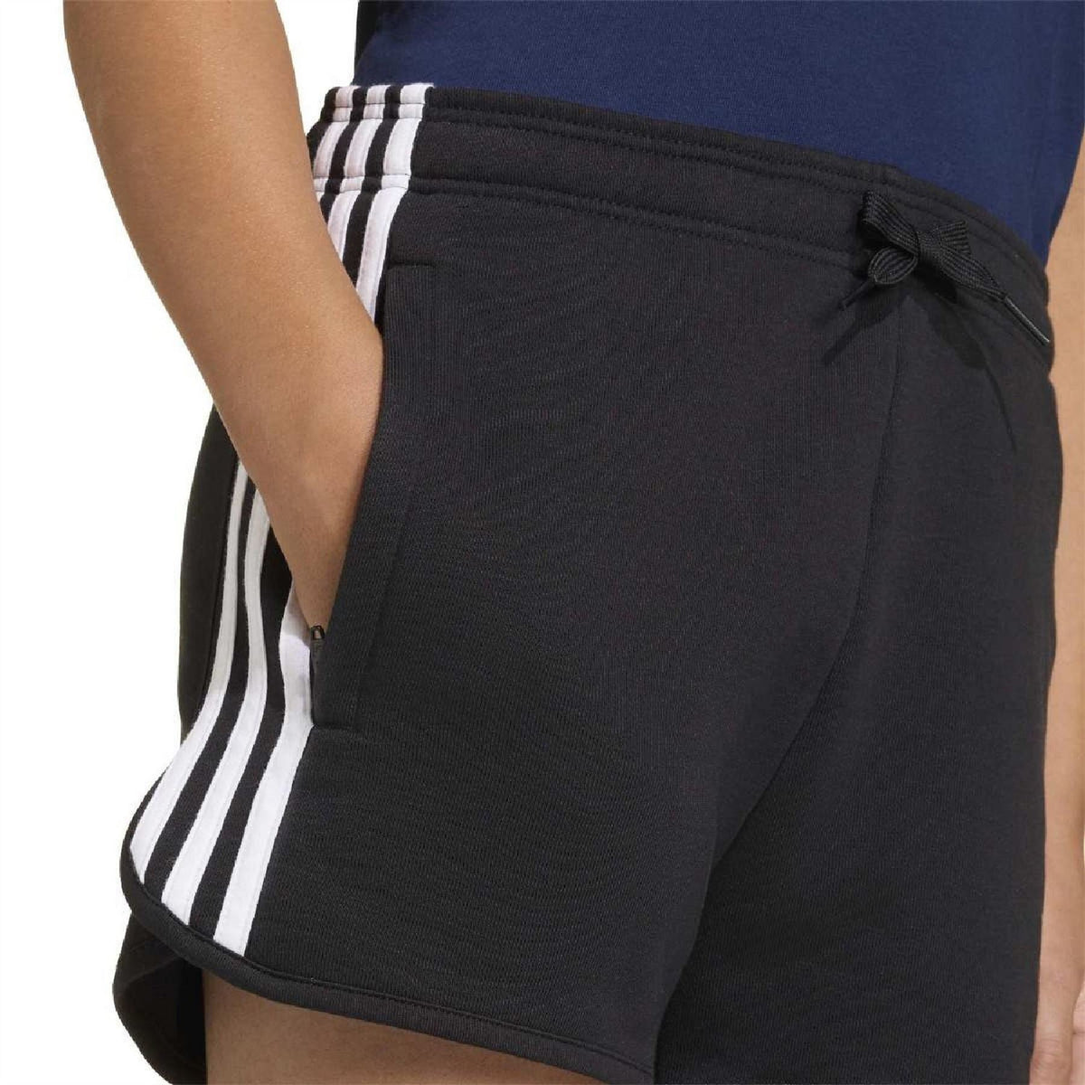Close-up of black drawstring shorts with three stripe detail on side