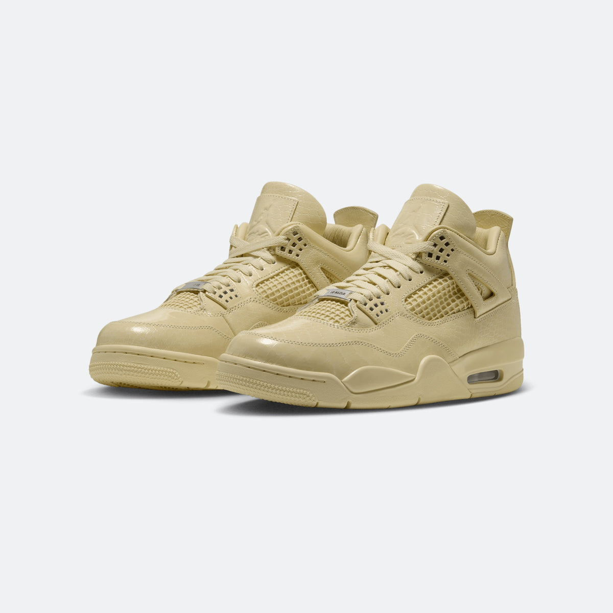 Yellow Jordan 4-style low-top sneakers, side view, lace-up with padded collar