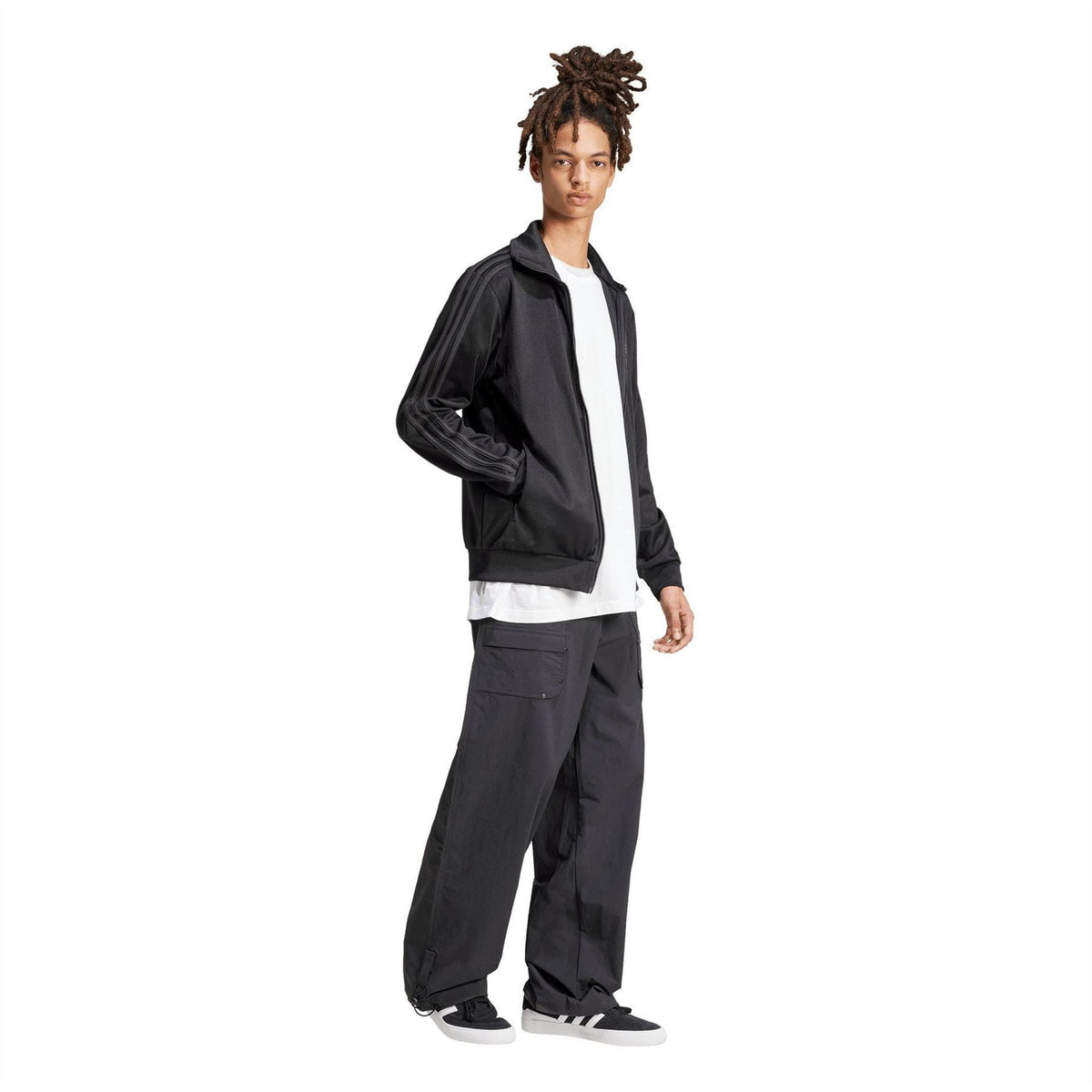 Adidas Originals BB TT tracksuit in green and black, featuring a zip-up jacket and matching pants on a white background.