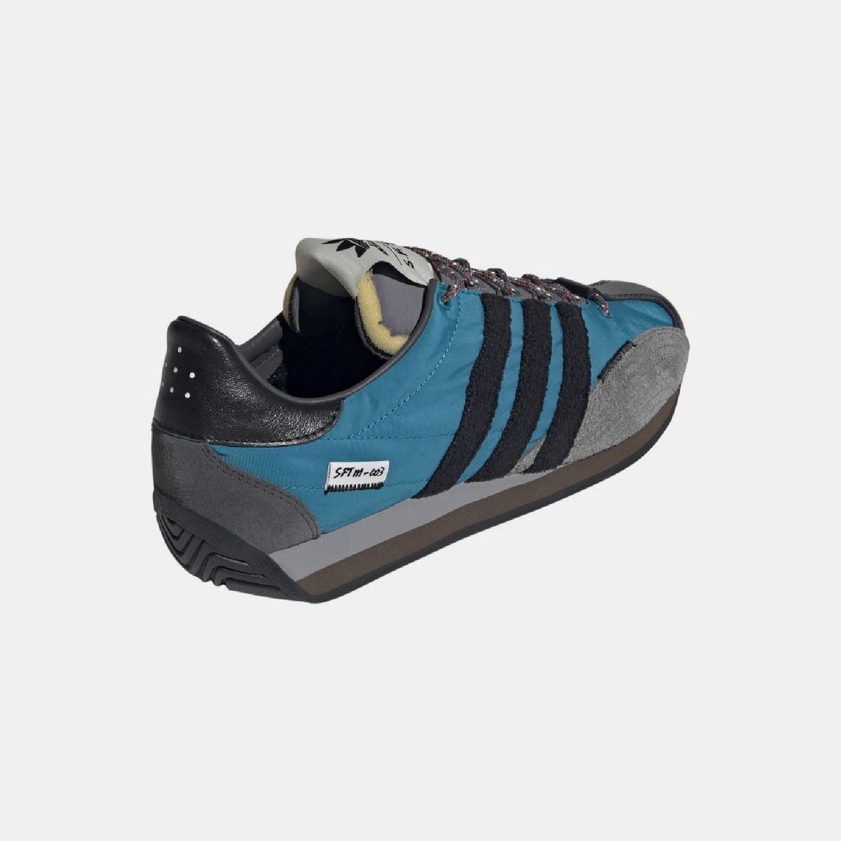 Teal and black adidas Country OG low sneakers with heel detail, gray sole, lace-up