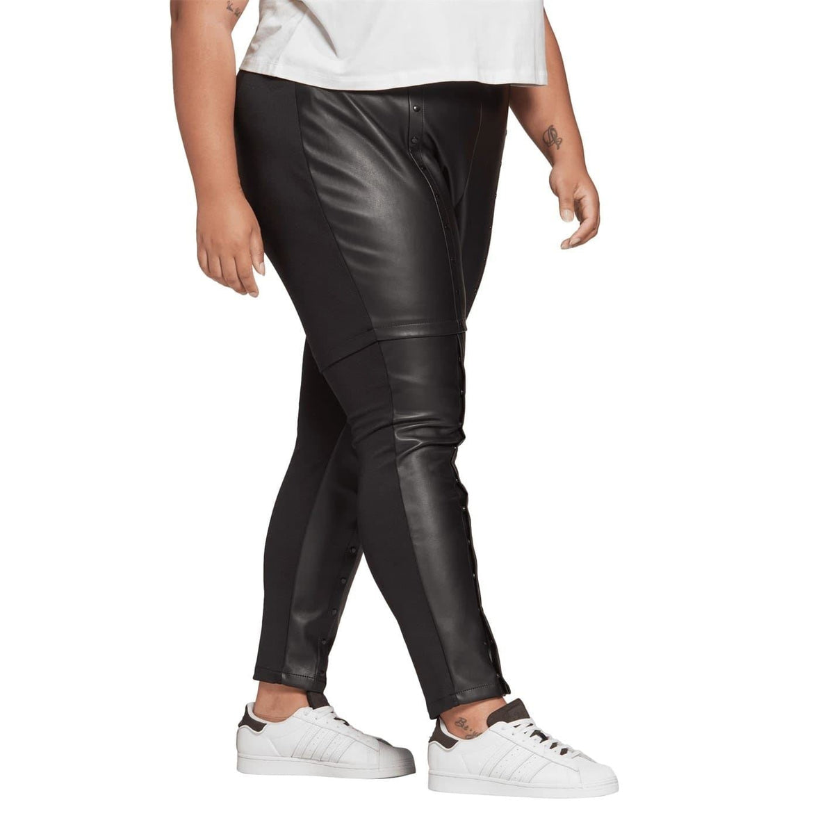 Black slim-fit legging pant with glossy texture and angled front panel seams