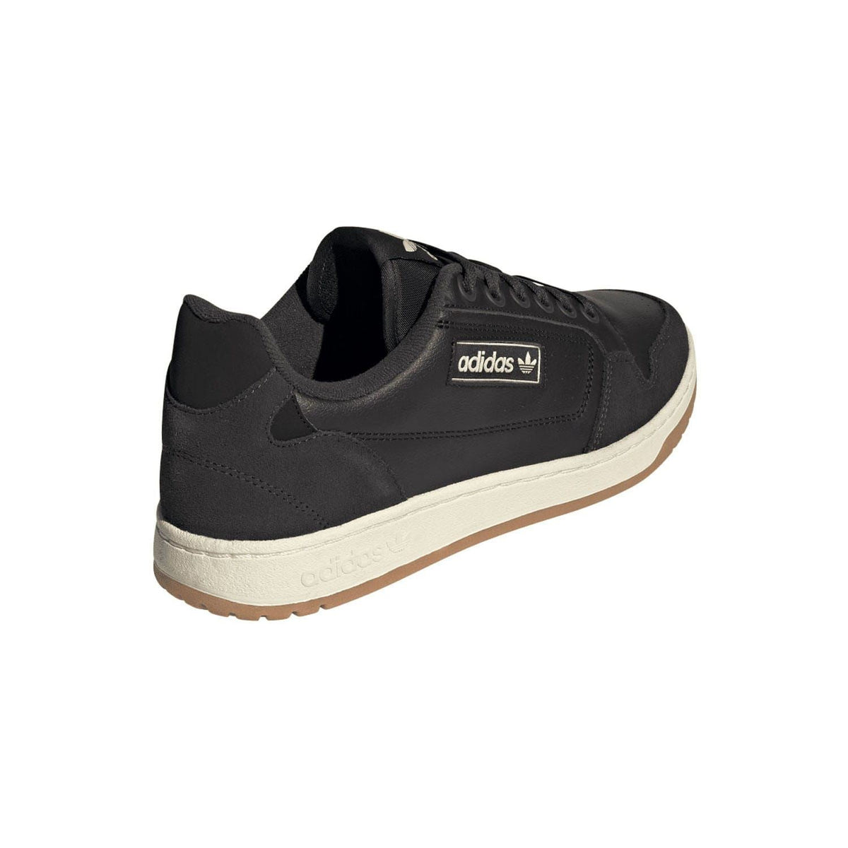 Black adidas trainer side view with lace-up closure, padded collar, and cream midsole