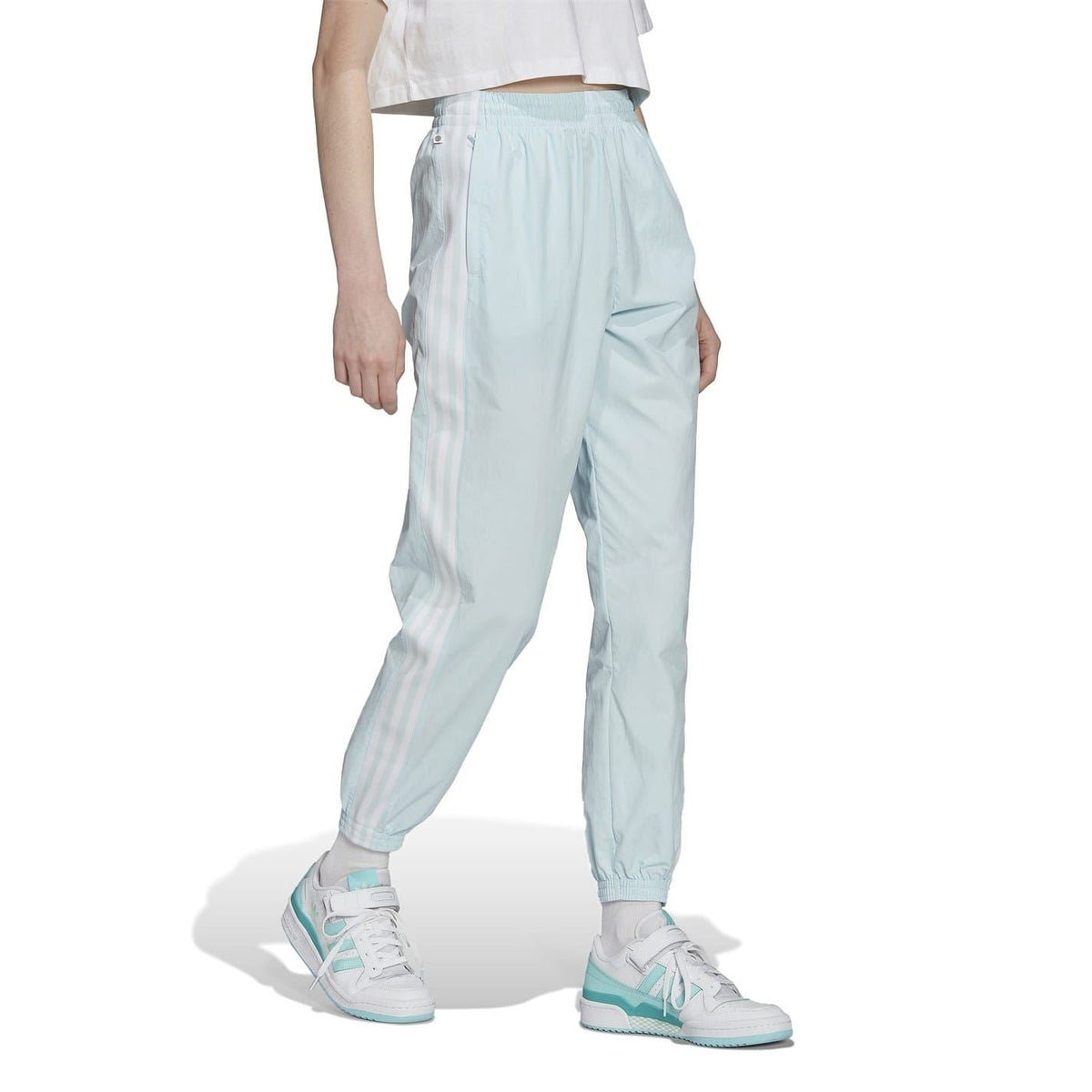 Light blue track sweatpants with diagonal side panel and elastic waistband
