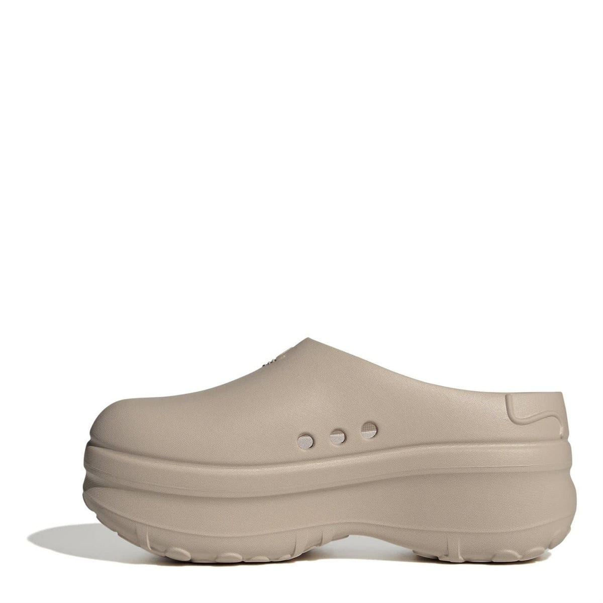 Beige low-top clog trainers with smooth upper, slip-on collar, and chunky rubber sole