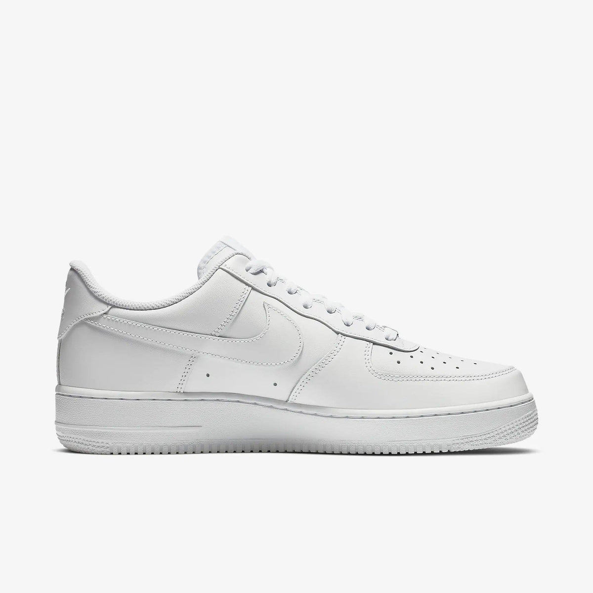 White leather low-top sneakers, side view with swoosh logo and perforations
