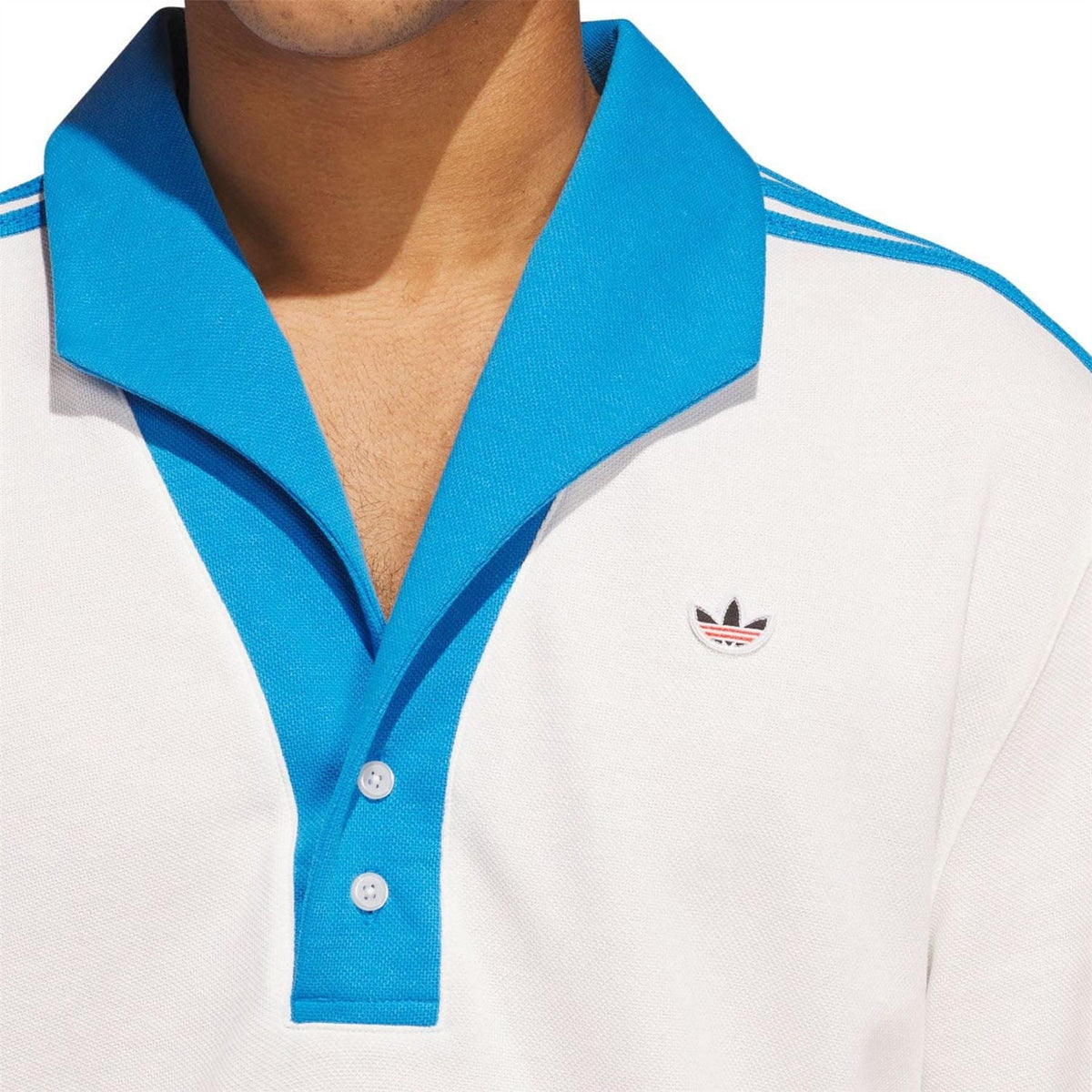 White polo shirt with blue contrast collar, button placket, and adidas trefoil chest logo