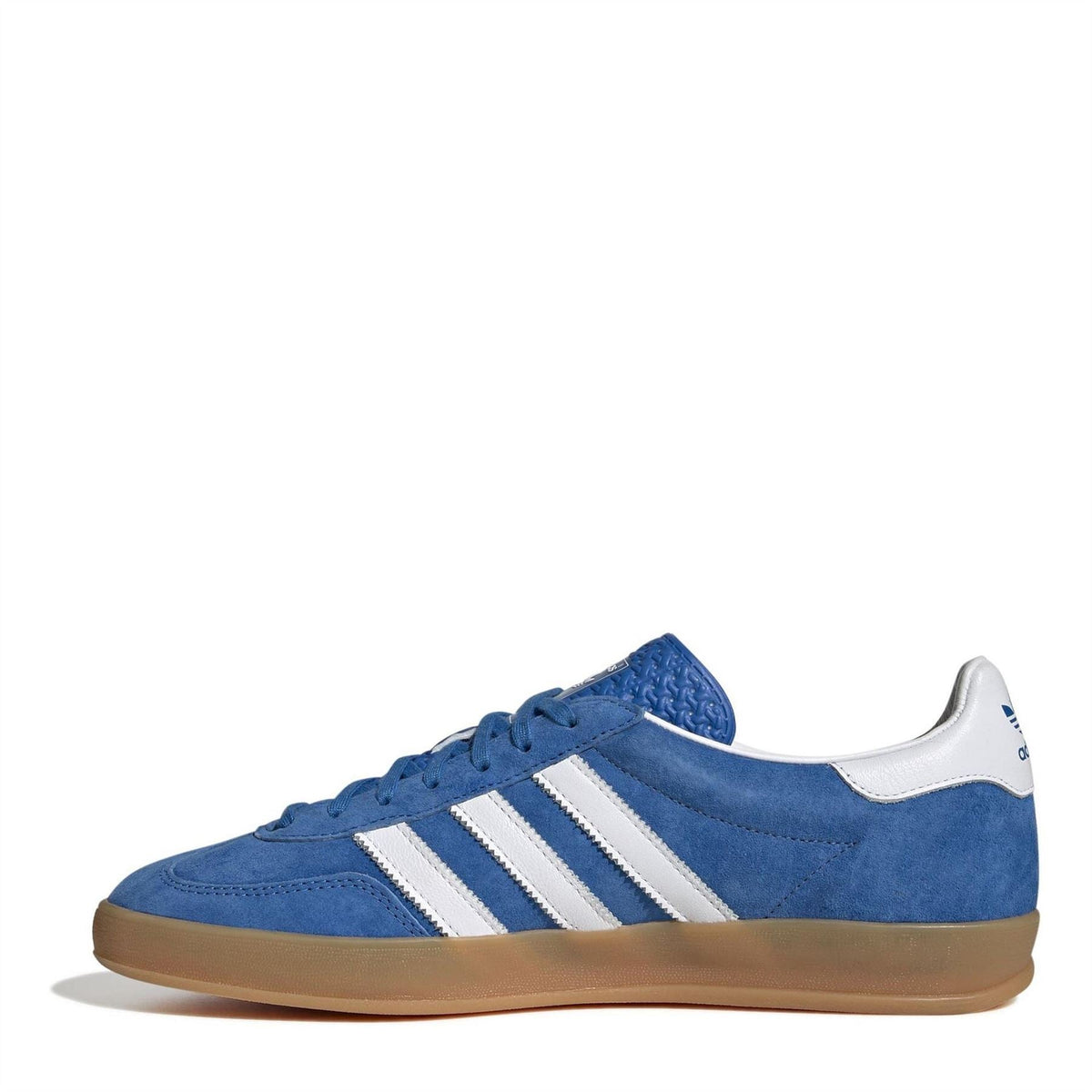 Blue low-top lace-up sneaker with white three-stripe detail and gum sole