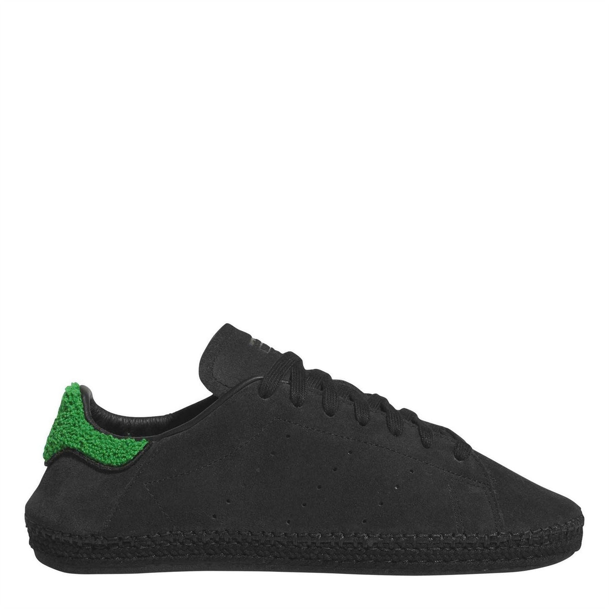 Black suede low-top trainers with green heel panel and lace-up front