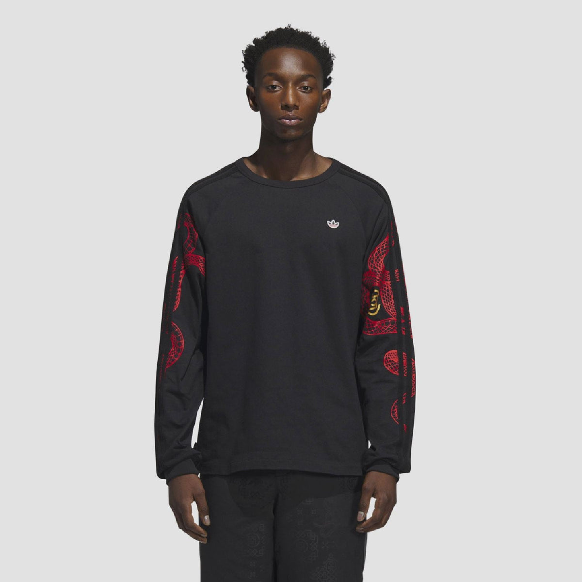 adidas Originals CLOT LNY long sleeve T-shirt with graphic design, black fabric, and branding visible in the image