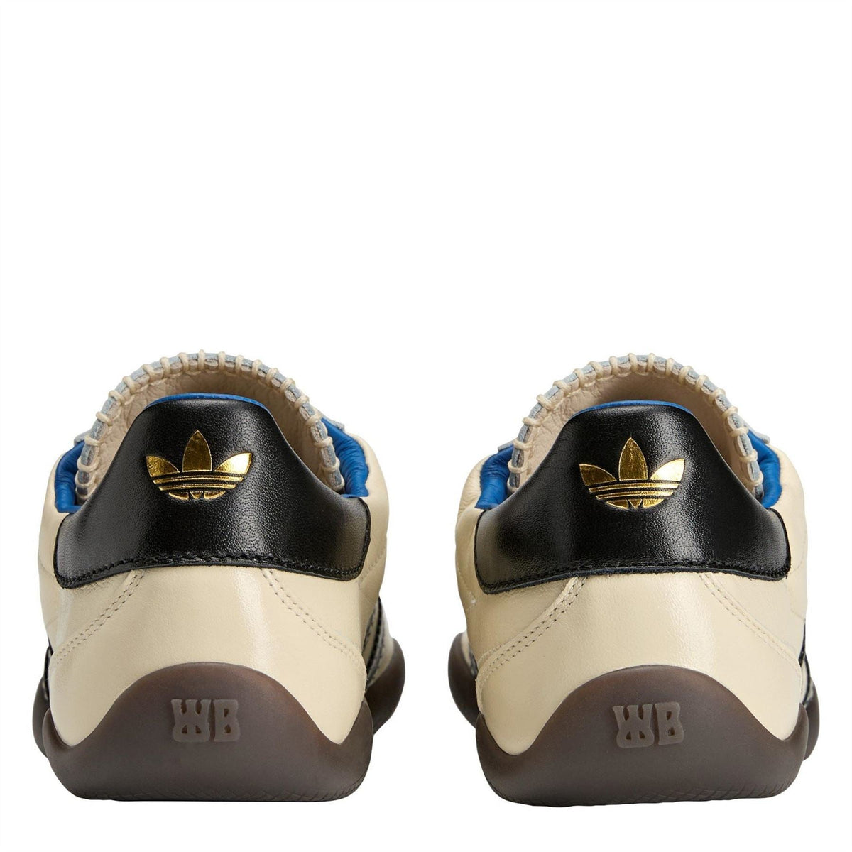 adidas Originals sneakers heel close-up with gold adidas logo, black panel, and brown tread