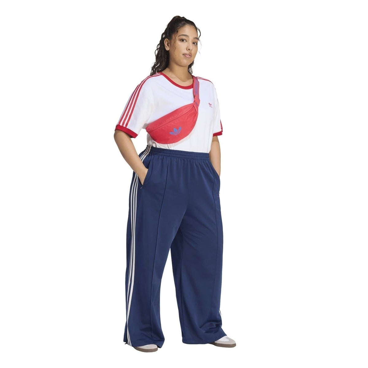 Wide-leg dark navy track pants with white triple side stripes and elastic waistband
