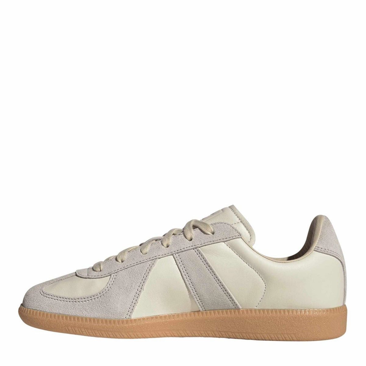 Cream and gray adidas low-top sneakers with lace-up front and gum outsole