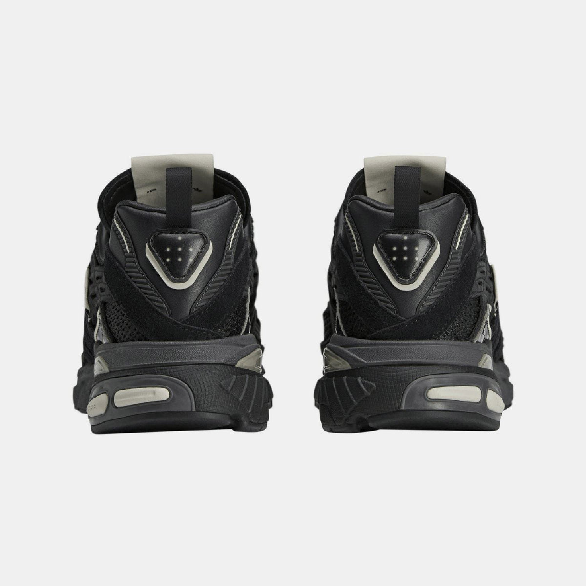 adidas Originals Adistar Cushion STFM trainers showing navy and white athletic footwear with cushioned soles and stylish design
