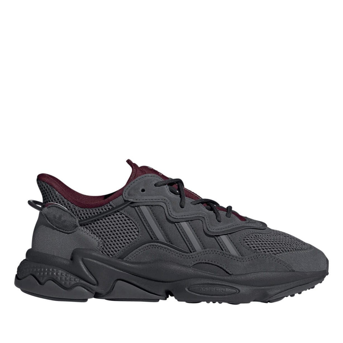 Grey sneaker with mesh upper, burgundy collar, and chunky rubber sole