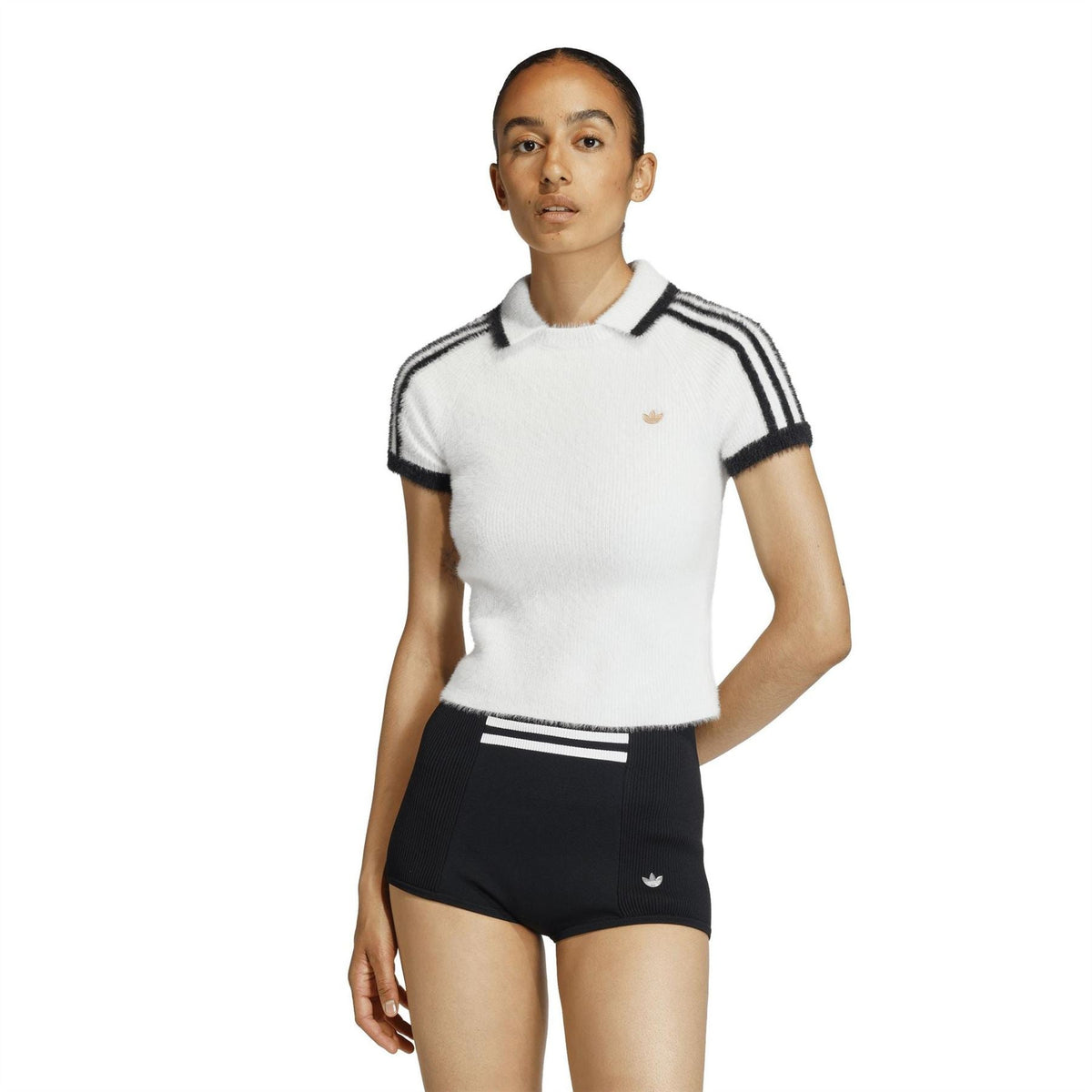 adidas Originals womens white polo shirt with black shoulder stripes and small gold trefoil