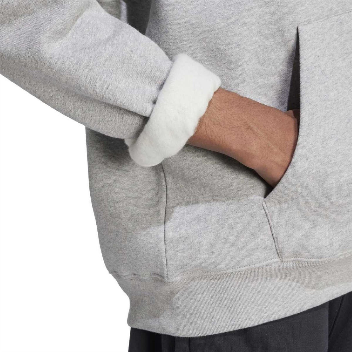 Grey hoodie close-up of sleeve and kangaroo pocket with ribbed cuff