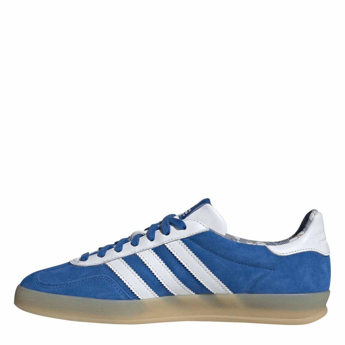 Blue canvas low-top sneakers with three white side stripes and lace-up design