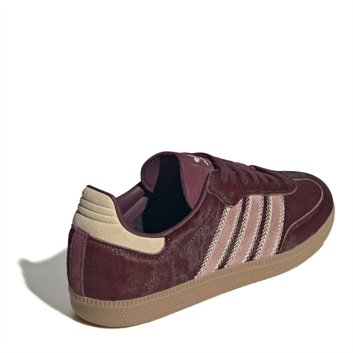 Burgundy adidas Samba OG sneakers, side view with three stripes and beige collar trim, gum sole