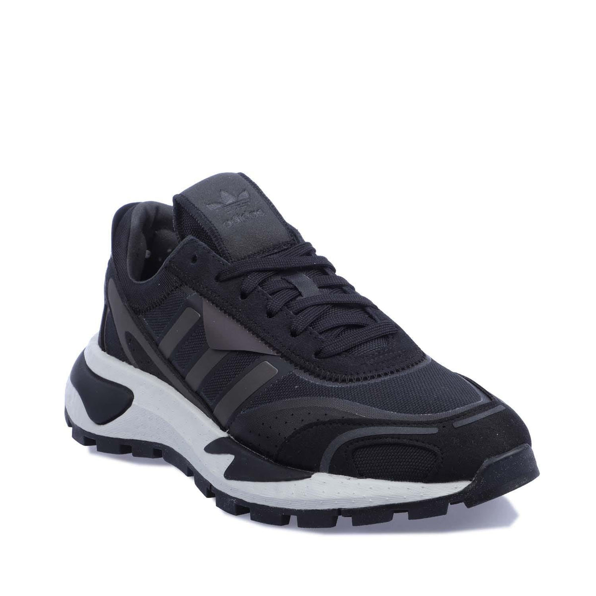 Black lace-up trainers with chunky sole and striped logo panels on the side.